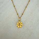 Load image into Gallery viewer, Gold flower pendant necklace on a light gray background
