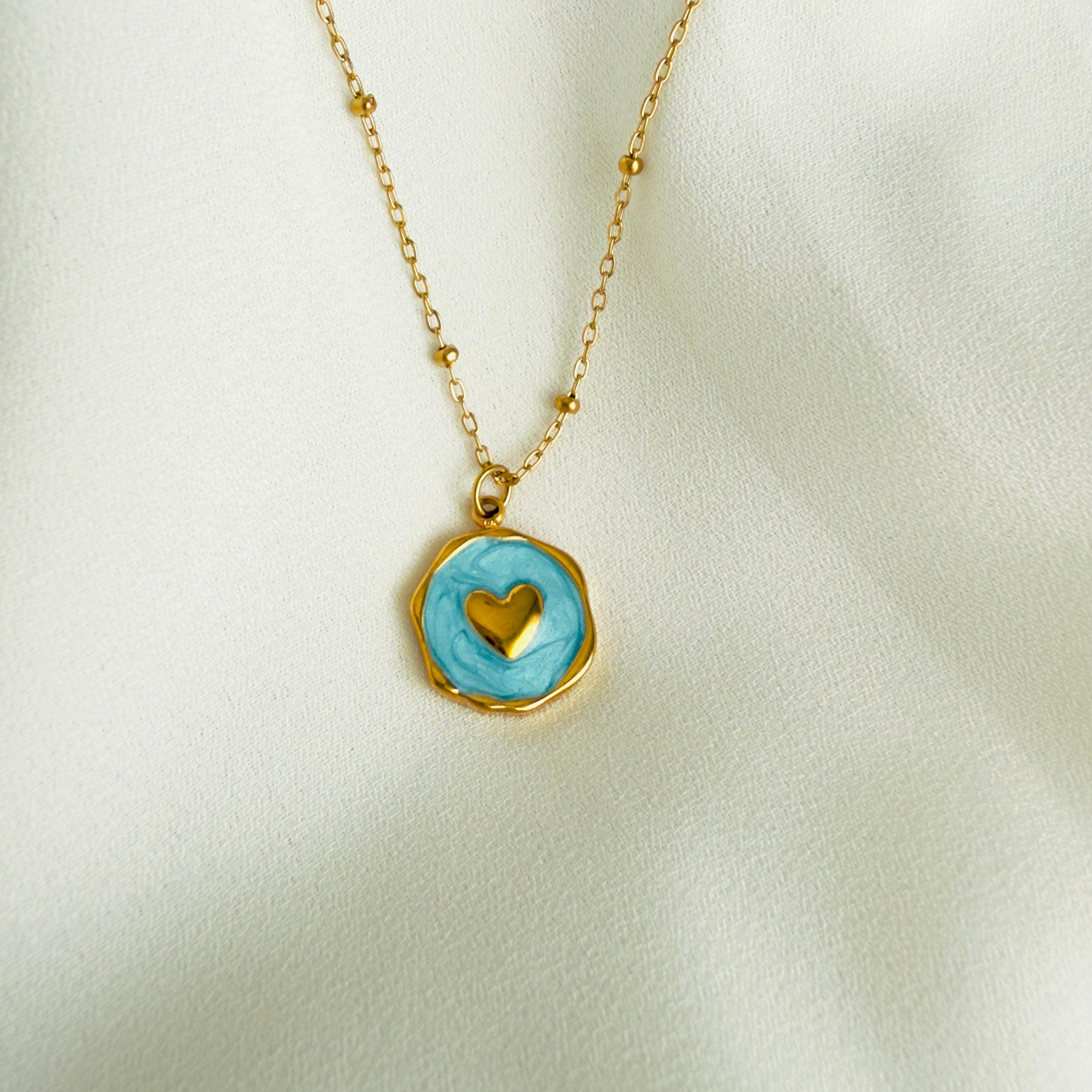 Gold plated Stainless steel necklace with a round blue enamel heart pendant