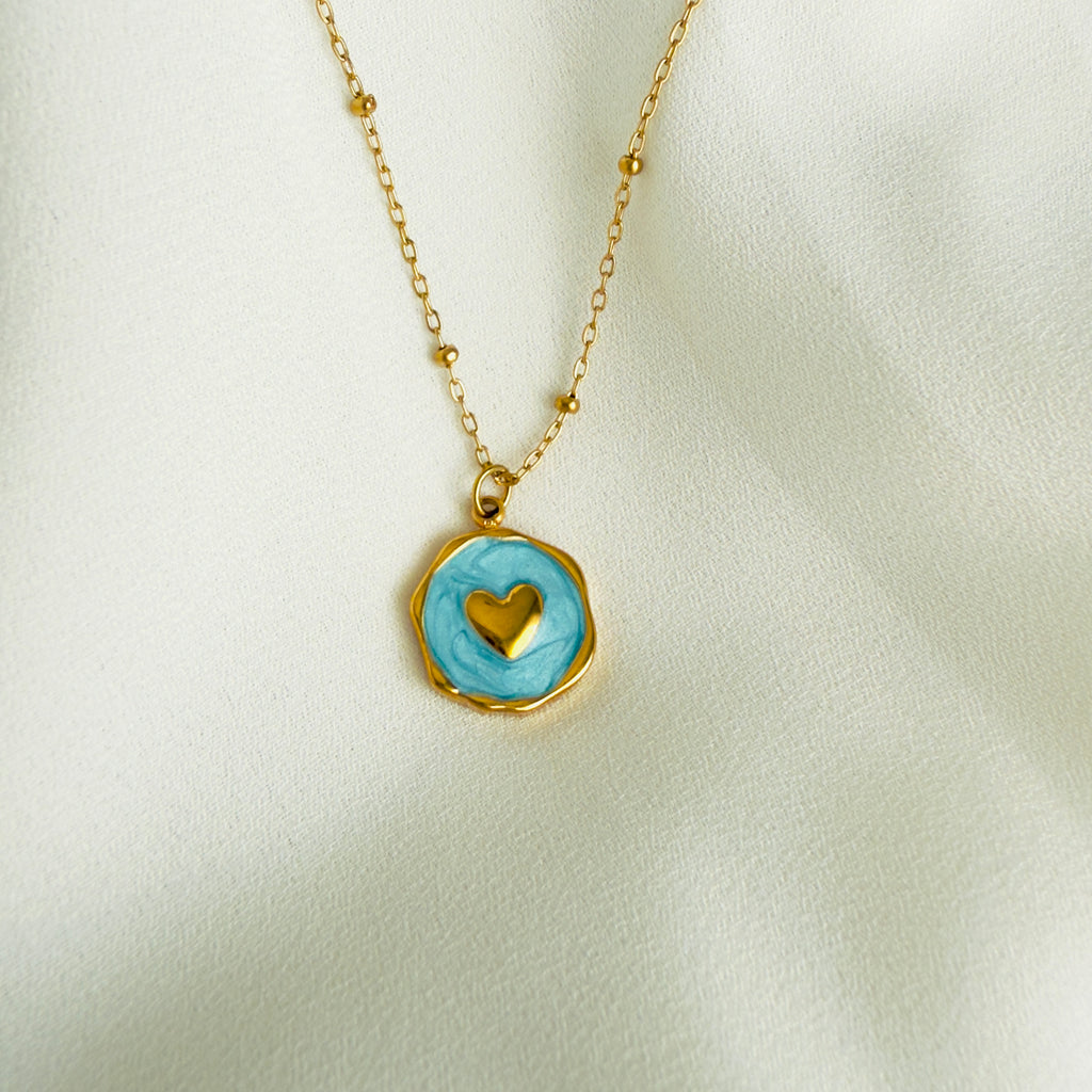 Gold plated Stainless steel necklace with a round blue enamel heart pendant