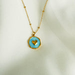 Load image into Gallery viewer, Gold plated Stainless steel necklace with a round blue enamel heart pendant
