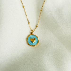 Gold plated Stainless steel necklace with a round blue enamel heart pendant