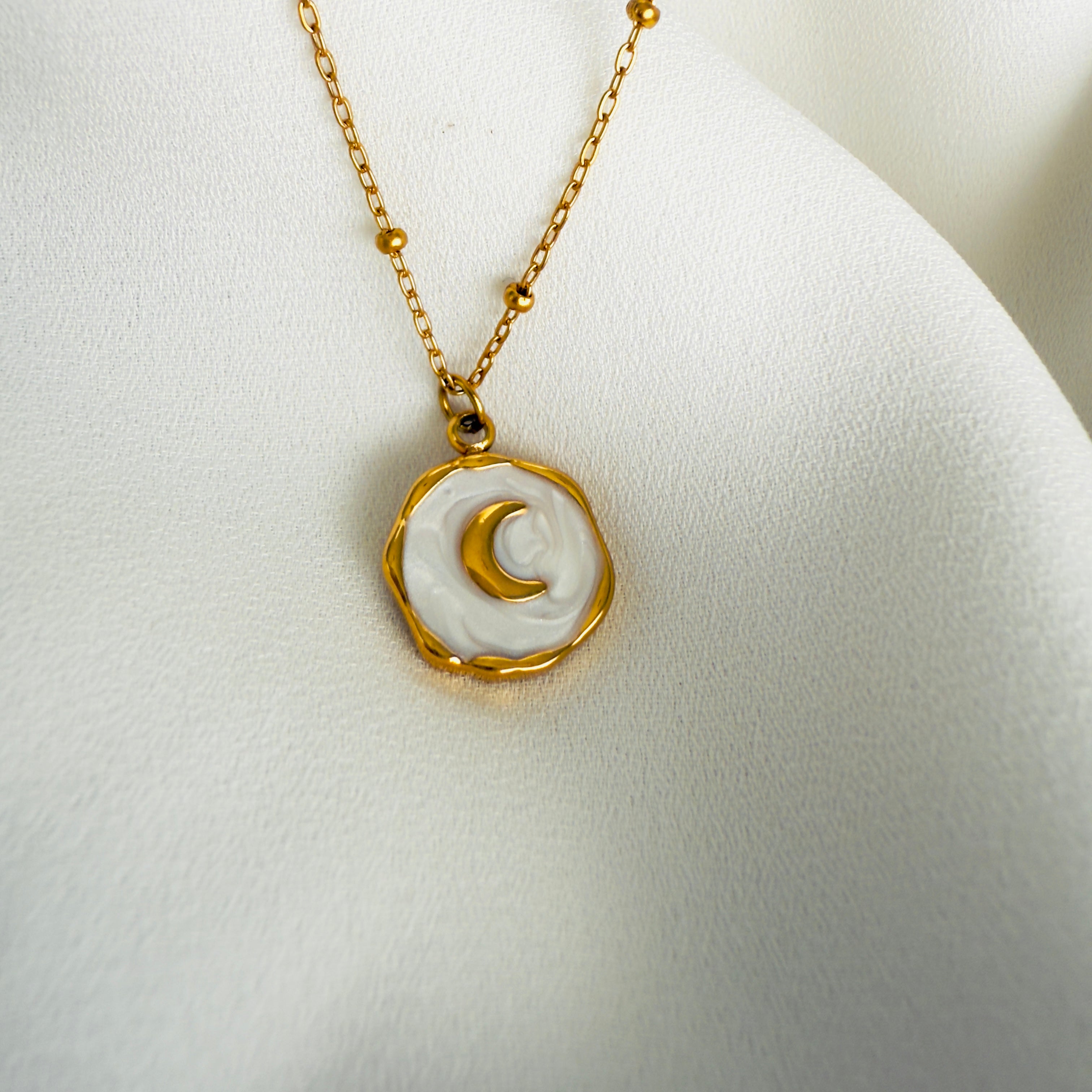 Gold plated Stainless steel necklace with a round white enamel moon pendant