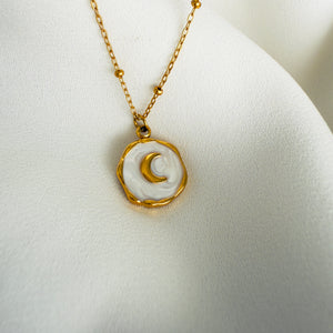 Gold plated Stainless steel necklace with a round white enamel moon pendant