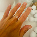 Load image into Gallery viewer, a hand wearing a double heart ring cuff made of sterling silver
