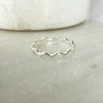 Load image into Gallery viewer, Silver ring with wavy design on a light gray background
