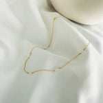 Load image into Gallery viewer, A gold filled trio pearl necklace, featuring groups of  three dainty freshwater pearls evenly spaced along a fine gold chain
